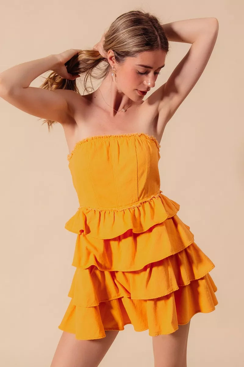 Close-up of layered ruffles on a strapless mini dress