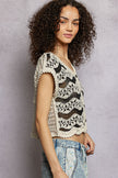 Cream and black crochet button-down boho vest with scalloped edges and relaxed fit