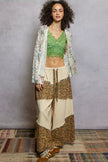 Front view of floral fringe cardigan with open neckline