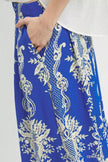 Flowy blue wide-leg pants with gold embroidered floral borders, elegant satin texture, high-waisted fit