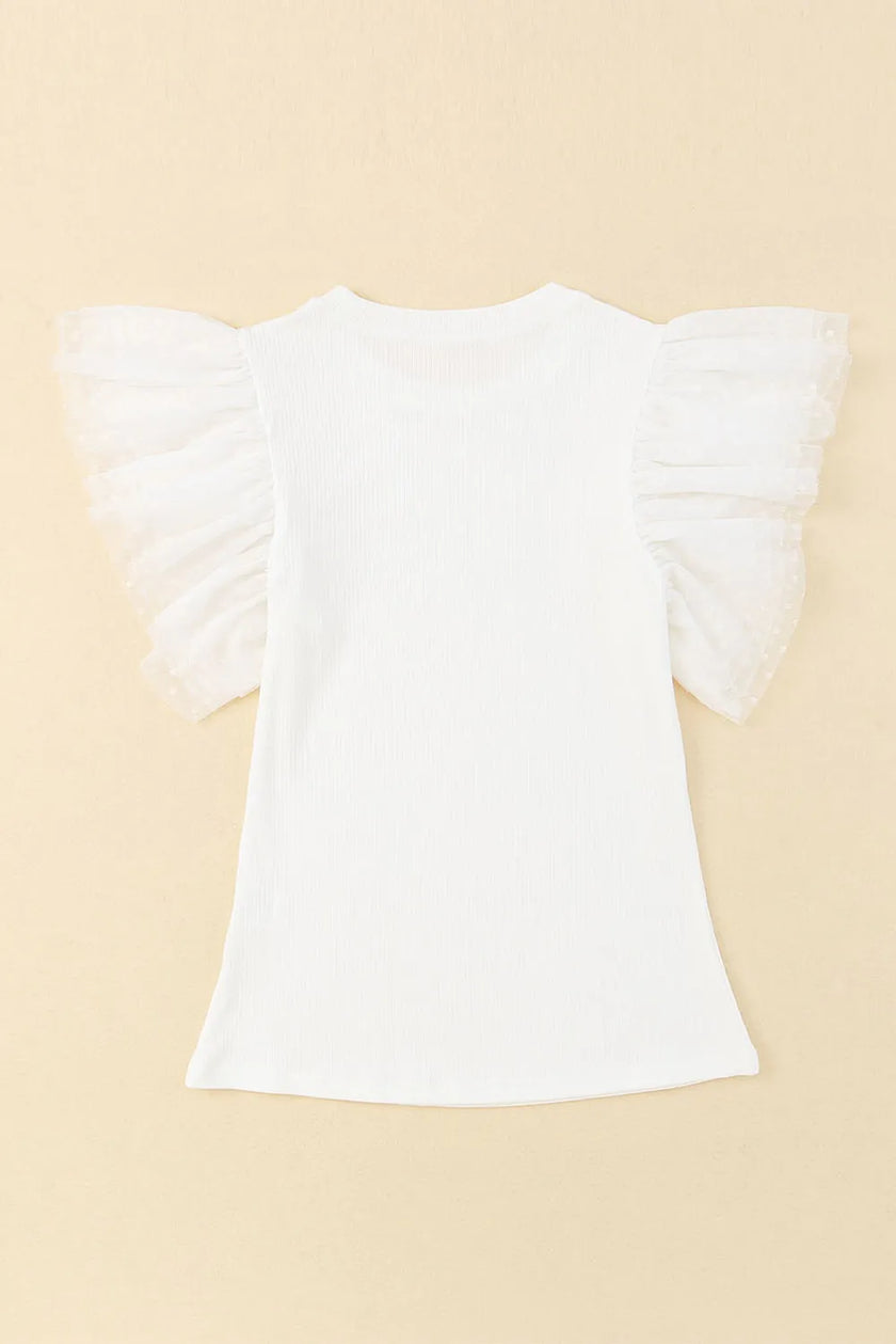 White ruffled cap sleeve blouse with textured fabric and relaxed fit