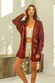 Red metallic knit V-neck cardigan with loose fit and shimmering texture