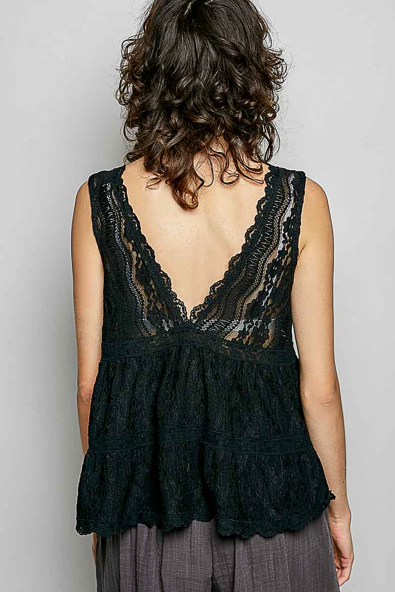 Black lace sleeveless top with deep V-back and scalloped ruffled hem in textured fabric