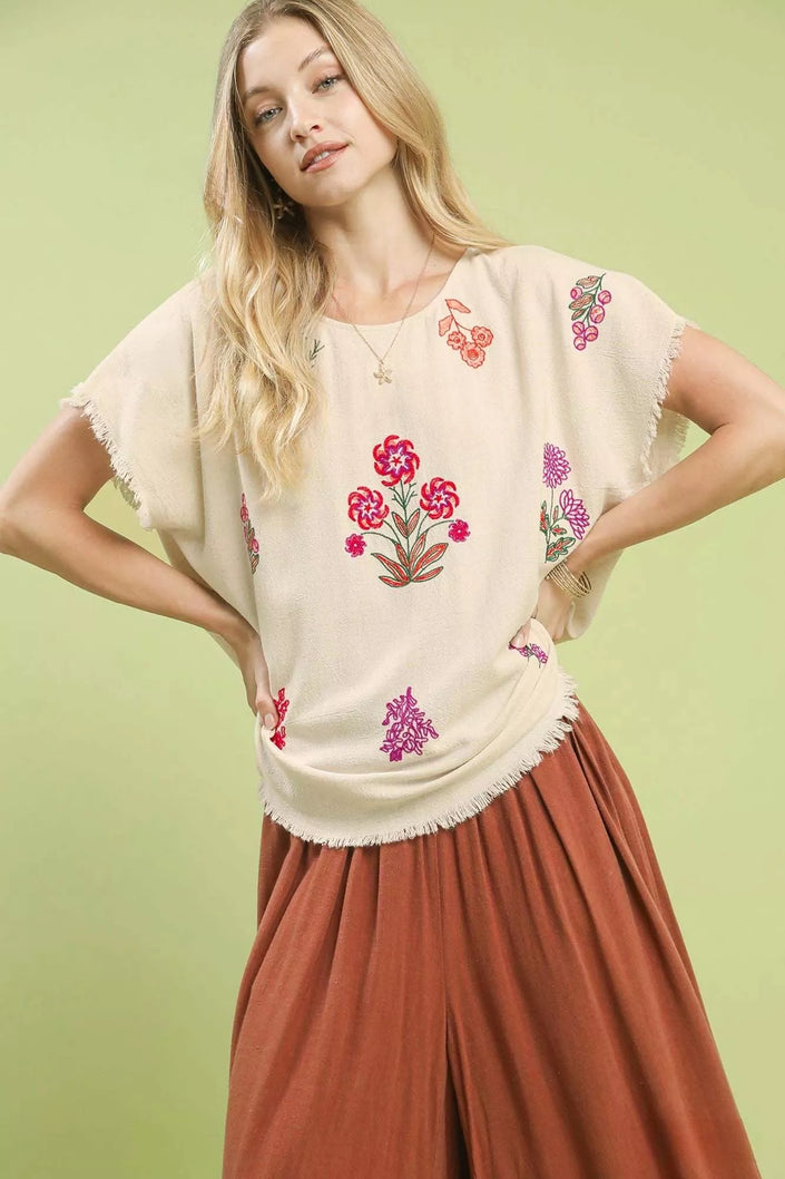 Embroidered floral linen top with frayed hem in oatmeal cream