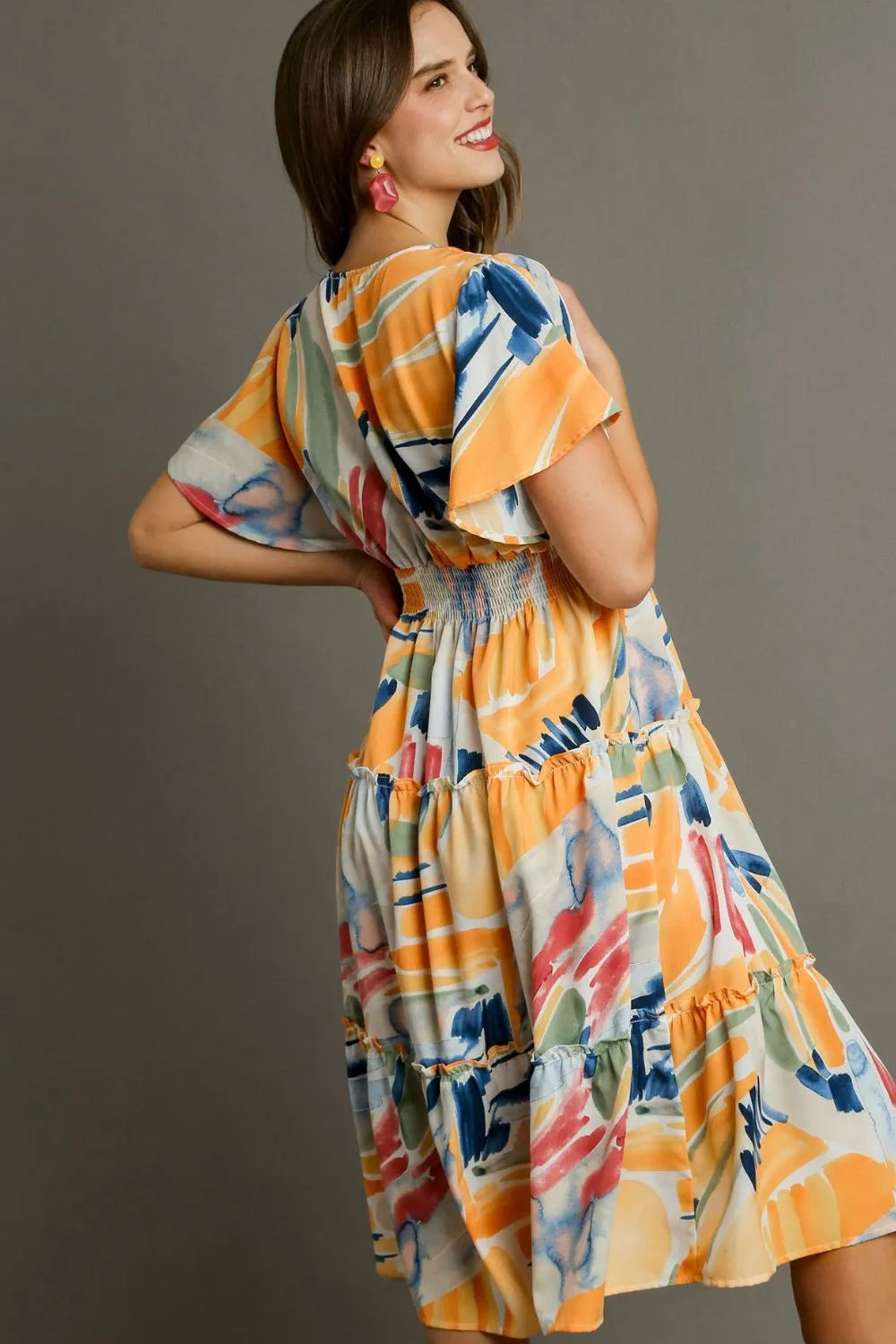 Vibrant abstract print flutter sleeve tiered midi dress with elastic waist and ruffled tiers