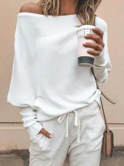 Oversized ribbed knit top with visible soft texture and breathable fabric