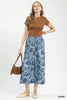 Blue stone wash denim wide leg crop pants with white floral patterns and frayed hems