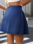 Medium-wash denim skirt with high-rise fit and button details