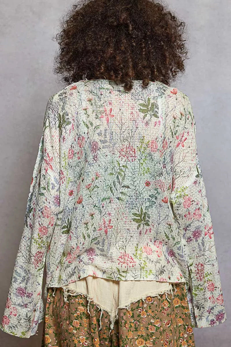 Textured floral pattern on open-front cardigan fringe detail