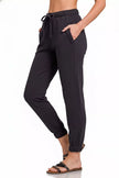 Black fleece joggers showcasing functional front pockets