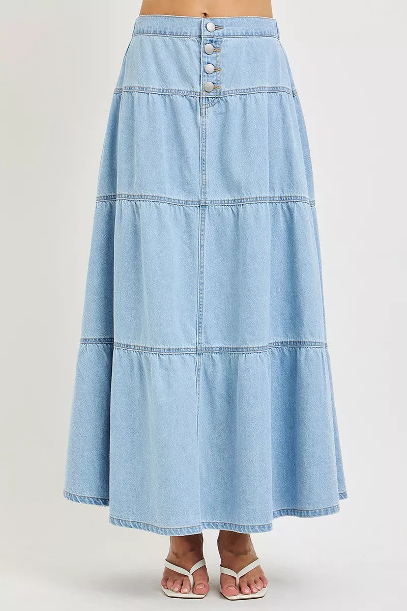 High-rise light wash denim maxi skirt with tiered ruffles and front button closure