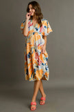Orange blue abstract print flutter sleeve tiered midi dress with frill waist and flowing fabric.