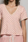 Pink ribbed v-neck short sleeve t-shirt with blue floral print and lace trim