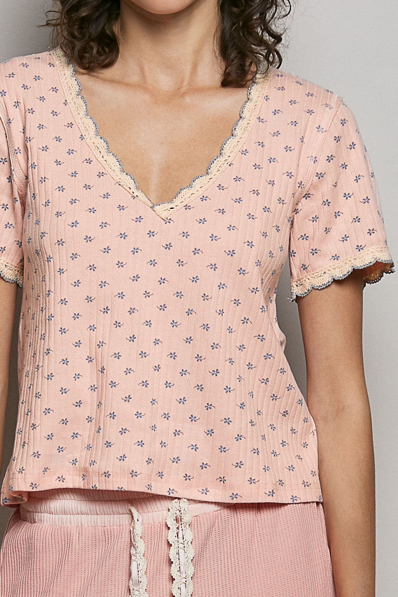Pink ribbed v-neck short sleeve t-shirt with blue floral print and lace trim