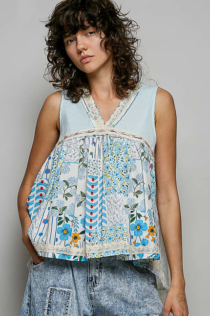 Light blue sheer v-neck tank top with floral print and white lace trim