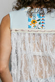 Light blue ribbed tank with floral patch and white sheer lace trim detail