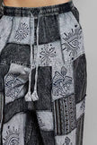 Grey and charcoal patchwork wide leg drawstring pants with bohemian mushroom and eye prints