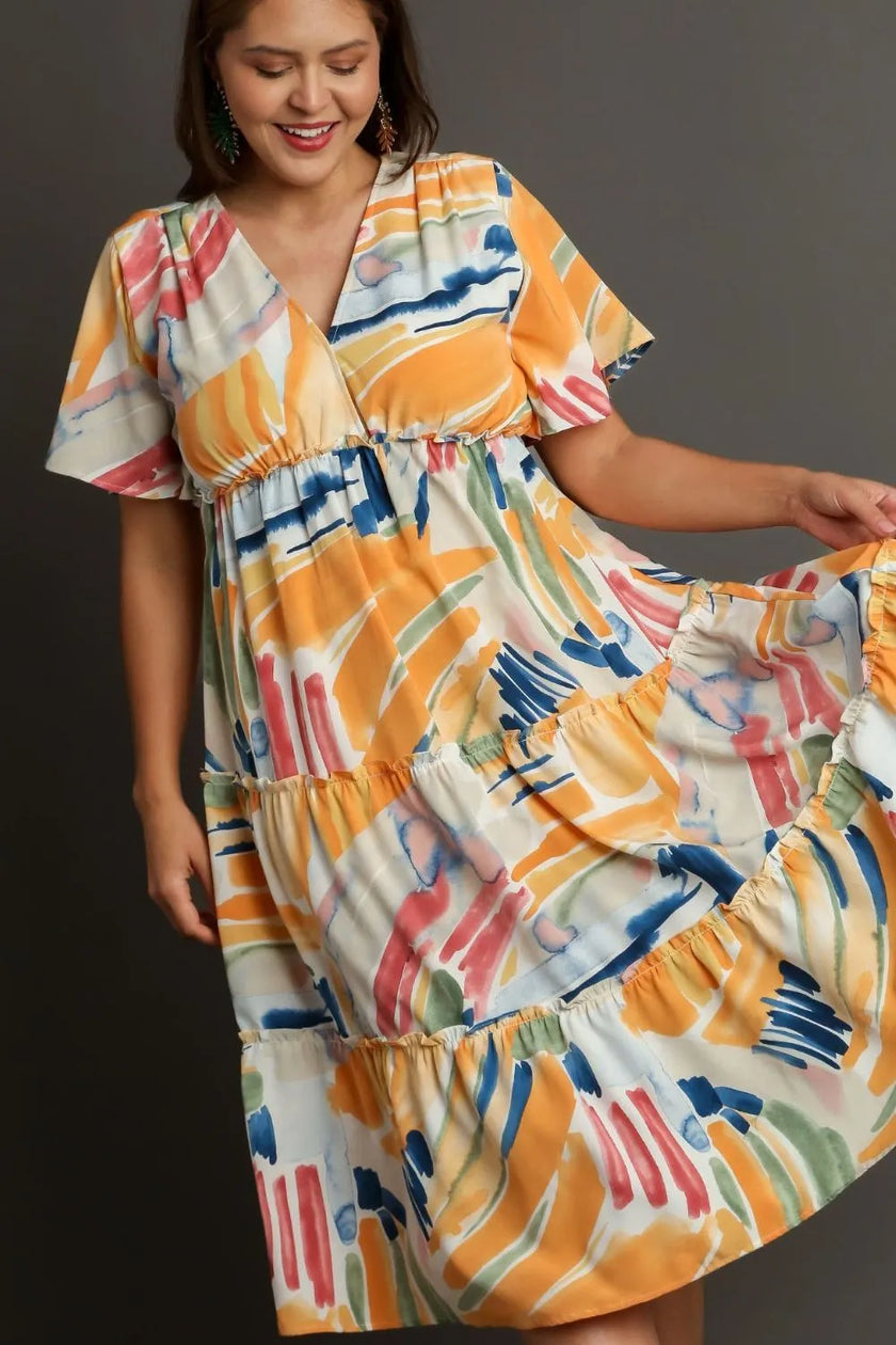 Vibrant abstract print flutter sleeve tiered midi dress with ruffled hem and relaxed fit