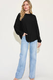 Back view of ribbed long sleeve tshirt with exposed seams detail