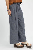 Close-up of drawstring waist on striped wide-leg pants
