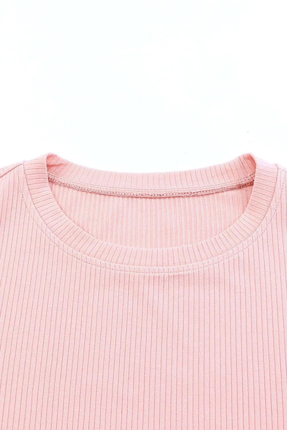 Soft pink ribbed knit round neck cap sleeve blouse close-up