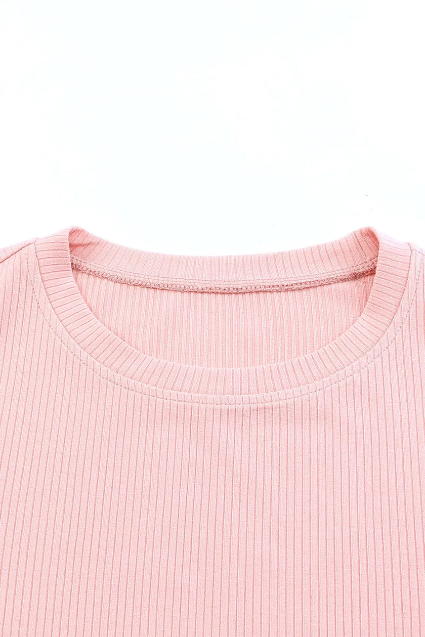 Soft pink ribbed knit round neck cap sleeve blouse close-up