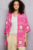 Crochet shirt featuring openwork floral granny square pattern with button closure