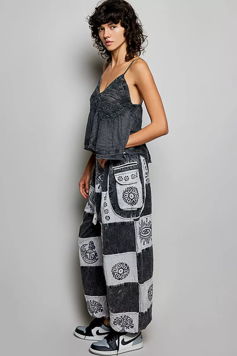 High-rise charcoal grey patchwork joggers with Aztec print designs and drawstring waist fit