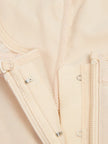 Light pink floral top with pronounced ruffled neckline detail