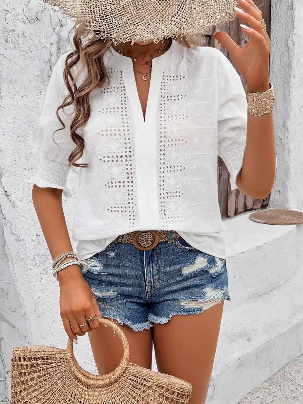 side view of white eyelet blouse showing semi-sheer fabric and flounce sleeves