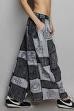 Grey and black patchwork wide leg drawstring pants with bohemian embroidered cosmic patterns