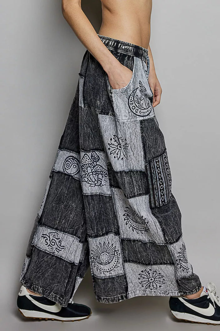 Grey and black patchwork wide leg drawstring pants with bohemian embroidered cosmic patterns