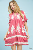 Pink mini dress with white border and floral print, ruffled sleeves, and loose linen fit.