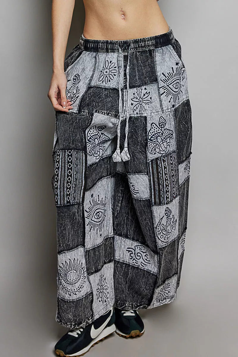 Grey and black patchwork wide leg drawstring pants with bohemian printed fabric texture