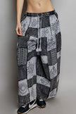 Grey and black patchwork wide leg drawstring pants with bohemian printed fabric texture