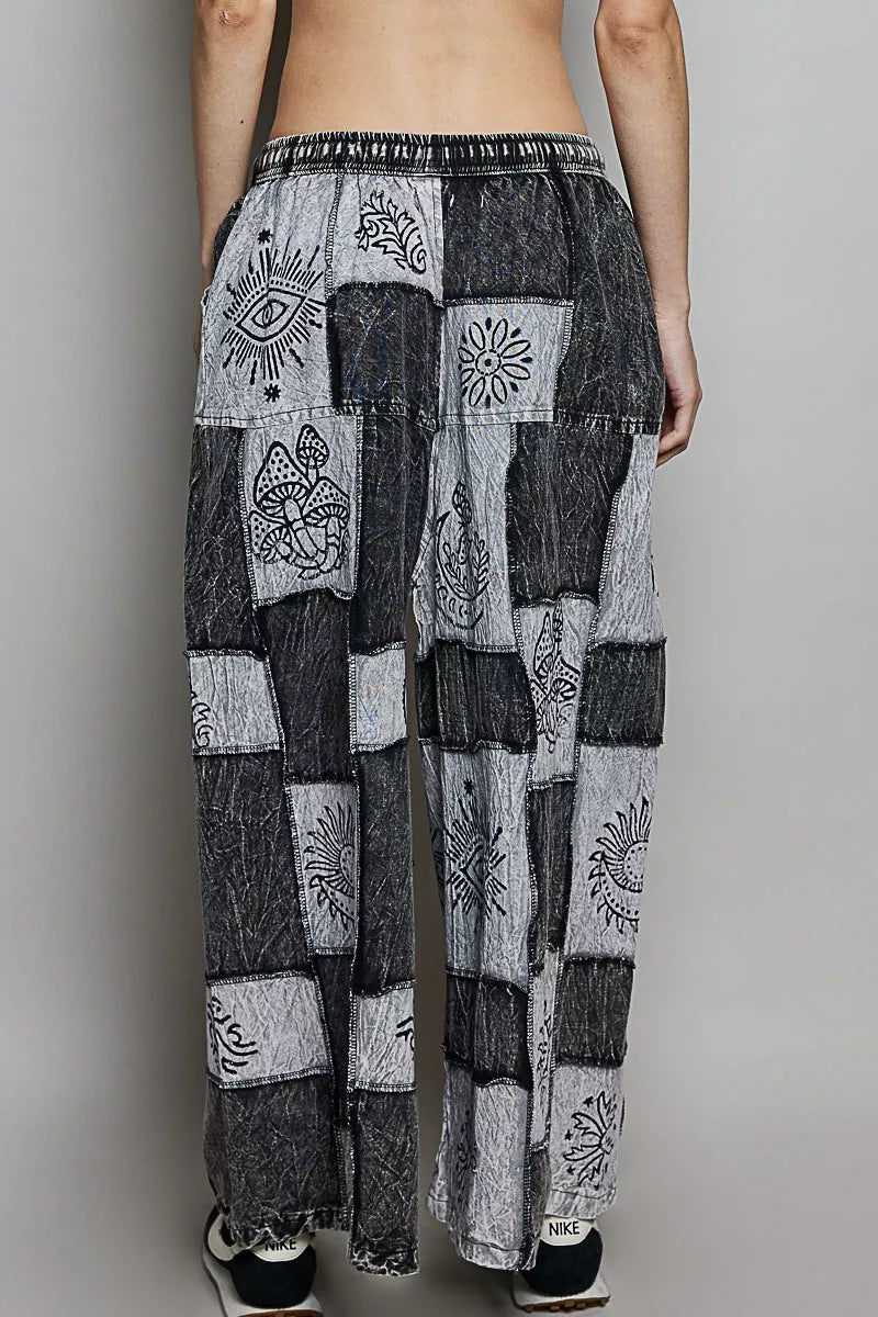 Grey and black patchwork wide leg drawstring pants with bohemian floral and eye prints