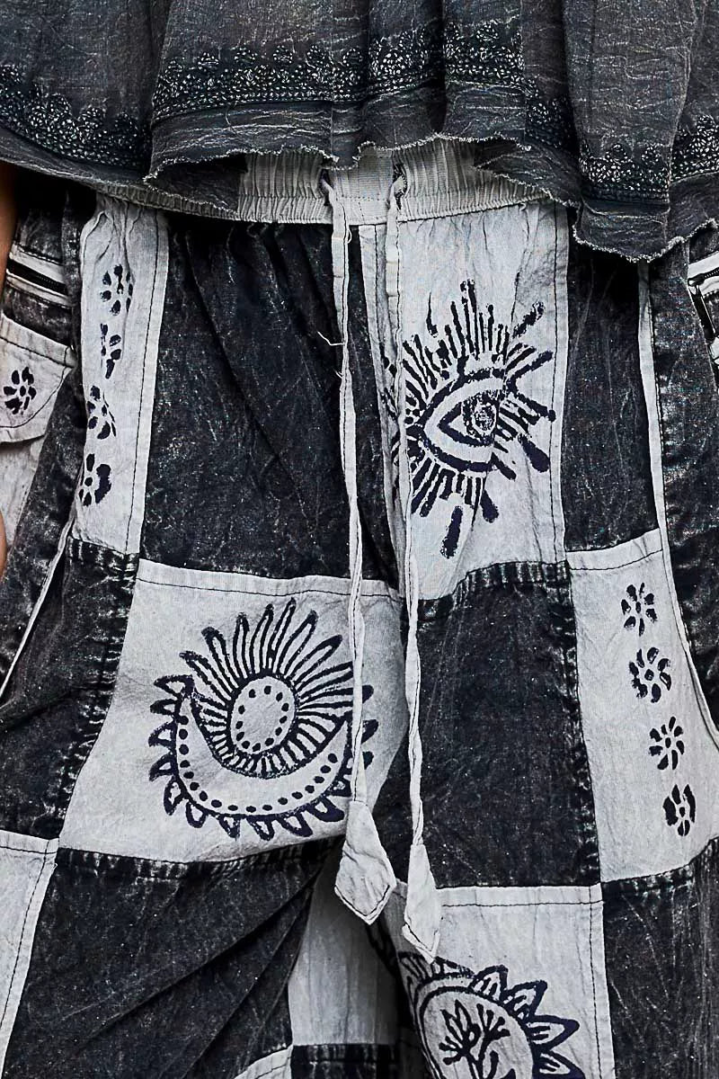 High-rise grey and black patchwork joggers with Aztec prints and drawstring waist