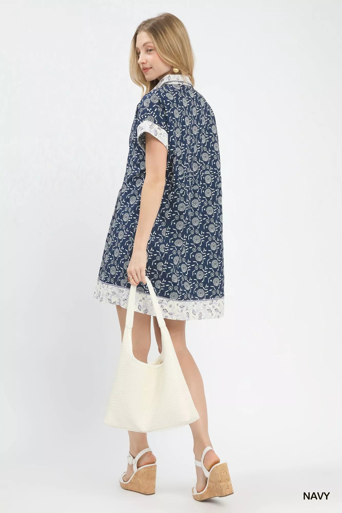 Casual polished shirt dress featuring border print and button closure