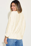 Model showcasing ribbed long sleeve tshirt with fitted silhouette