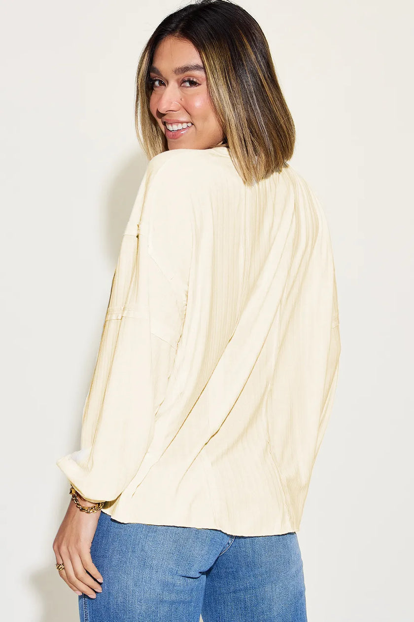 Model showcasing ribbed long sleeve tshirt with fitted silhouette