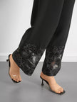 High-rise lace hem wide leg pants displayed on mannequin